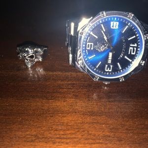 Steel watch and skull ring